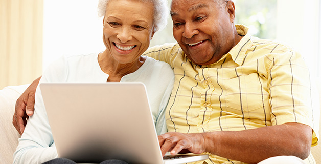 Senior couple filling out easy, online rental application